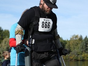 Denny Ross, who was paralyzed from the chest down in a car accident five years ago, attempts to finish a 5 Kilometre race at the annual N.E.R.D. Run at William Hawrelak Park in Edmonton, Ab., on Saturday, Sept. 19, 2015, with the use of a ReWalk Exoskeleton. CLAIRE THEOBALD Edmonton Sun