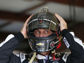 Kevin Harvick, driver of the #4 Jimmy John's / Budweiser Chevrolet, puts on his helmet during practice for the NASCAR Sprint Cup Series MyAFibRisk.com 400 at Chicagoland Speedway on Sept. 19, 2015. (Jonathan Ferrey/Getty Images/AFP)