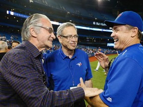 Postmedia Inc. President Paul Godfrey introduces Finance Minister and Conservative candidate Joe Oliver to Blue Jays manager John Gibbons before the Toronto Blue Jays took on the Boston Red Sox at the Rogers Centre on Sept. 19, 2015. (Stan Behal/Toronto Sun)