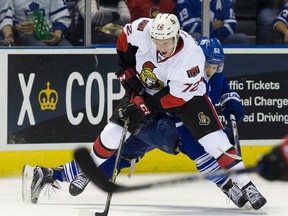 Ottawa Senators defenceman Thomas Chabot takes control of the puck away from Toronto Maple Leafs forward William Nylander during their NHL Rookie Tournament hockey game at Budweiser Gardens in London, Ont. on Friday September 11, 2015. Craig Glover/The London Free Press/Postmedia Network