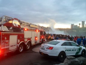 In this photo provided by WIVB, a crowd gathers near where someone reportedly went over the American Falls in Niagara Falls, N.Y., Saturday, Sept. 19, 2015. (WIVB via AP)