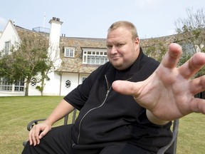Kim Dotcom gestures towards a camera after an interview with Reuters in Auckland in this January 19, 2013 file photo. (REUTERS/Nigel Marple/Files)