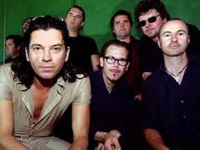 Australian band INXS, (L to R) lead singer Michael Hutchence, Jon Farriss, Kirk Pengilly, Andrew Farriss, Tim Farriss and Garry Beers pose for photographers in Sydney in this Sept. 25, 1996 file photo. REUTERS/Megan Lewis