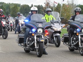 Chatham-Kent police Const. Jason Herder, front left, and Const. Mike Currie, far right, lead the way from Duke’s Harley-Davidson, which was the starting point for Saturday’s Torch Ride for Special Olympics. Blair Andrews/Postmedia Network