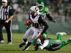 Ottawa RedBlacks wide receiver wide receiver Chris Williams shakes a tackle against the Saskatchewan Roughriders during second half CFL action in Regina on Saturday, September 19, 2015. THE CANADIAN PRESS/Mark Taylor