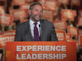 NDP Leader Tom Mulcair laughs on stage during his speech to a campaign rally in St. John's, N.L., on Sunday, Sept. 20, 2015. THE CANADIAN PRESS/Andrew Vaughan