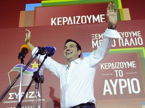 Former Greek prime minister and leader of leftist Syriza party Alexis Tsipras waves to supporters after winning the general election in Athens, Greece, Sept. 20, 2015. REUTERS/Michalis Karagiannis