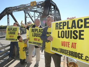 Elmwood MLA Jim Maloway (r) and supporters Ed Innes, Jason and Jared Schreyer and Randy Schulz demonstrate for a new Louise Bridge in Winnipeg, Man. Sunday Sept. 20, 2015.