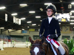 Erin Smith, 13, from Kingston wins first place in the Hunter class on 12-year-old Jack, a mixed pony, at the 185th Kingston Fall Fair in Kingston, Ont. on Sunday September 20, 2015. Steph Crosier/Kingston Whig-Standard/Postmedia Network