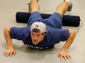 Edmonton Oilers defenceman Oscar Klefbom does some stretching during team medicals at Rexall Place On Sept. 17 , 2015. Photo by Tom Braid/Edmonton Sun.