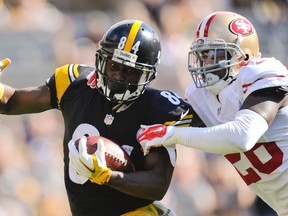 Pittsburgh Steelers wide receiver Antonio Brown (84) twists away from San Francisco 49ers cornerback Tramaine Brock (26) to go for a big gain after making a catch in the second quarter of an NFL football game, Sunday, Sept. 20, 2015, in Pittsburgh. (AP Photo/Don Wright)