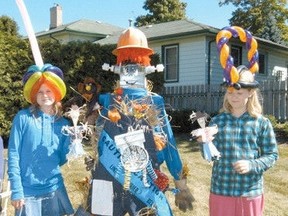 At the 2009 Scarecrow Festival Huron Centennial Public School students Laura Henderson and Samantha Lawson showed their support for the people’s choice award for best scarecrow. (Laura Broadley Clinton News Record)