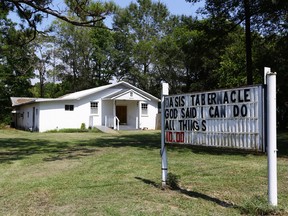 The Oasis Tabernacle Church is seen in East Selma, Ala., on Sunday, Sept. 20, 2015. Dallas County District Attorney Michael Jackson says suspect James Minter has been charged with three counts of attempted murder after allegedly shooting a woman, an infant and a pastor inside the church. (Alaina Denean Deshazo/The Selma Times-Journal via AP)
