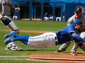 Blue Jays Kevin Pillar dives to first past the tag but Toronto falls short to Boston Red Sox at the Rogers Centre in Toronto Sunday September 20, 2015. (Stan Behal/Toronto Sun)