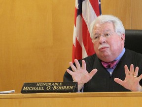 In this March 13, 2015, file photo, Judge Michael Bohren, of the Waukesha County Court, explains his decision to try two girls as adults in the Slenderman stabbing case in Milwaukee. On Monday, the judge halted the case to allow time for a review of an appeal. The girls are accused of repeatedly stabbing a classmate as a sacrifice to an online horror character. (Michael Sears/Milwaukee Journal-Sentinel via AP)