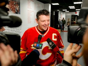 Calgary Flames alumnus Theoren Fleury chats with media before the Nathan O'Brien Charity Hockey Game at the Scotiabank Saddledome in Calgary on Feb. 5, 2015. (Lyle Aspinall/Calgary Sun)