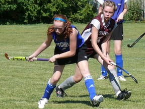 Maddy Larivee (left) of the Mitchell District High School (MDHS) field hockey team clears the ball during opening Huron-Perth action in Goderich last Wednesday, Sept. 16. The Blue Devils won, 1-0, over Stratford Northwestern. SUBMITTED