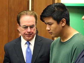 Adrian Jerry Gonzalez, center, is flanked by public defender Larry Biggam and attorney Leila Sayar as they enter the courtroom Thursday, July 30, 2015 where his arraignment was delayed in Santa Cruz, Calif.  Gonzalez charged with murder, kidnapping and rape in the death of 8-year-old Madyson Middleton, in an artists' complex in the California beach town. (Dan Coyro/Santa Cruz Sentinel via AP)