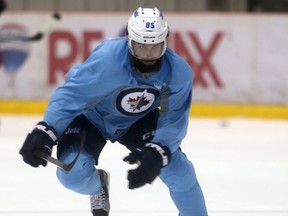 Jet Mathieu Perreault on the ice during training camp Saturday, Sept.19, 2015.