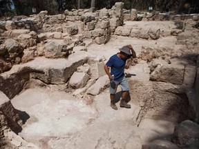 A worker for the Israel Antiquities Authority walks at an archeological site at Ben Shemen Forest near the Israeli city of Modiin on Monday, Sept. 21, 2015. Israeli archaeologists may be one step closer to solving a riddle that has vexed explorers for more than a century: the location of the fabled tomb of the biblical Maccabees. (AP Photo/Dan Balilty)