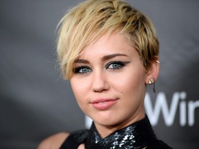 Singer Miley Cyrus arrives at the 2014 amfAR Inspiration Gala at Milk Studios in Los Angeles, in this Oct. 29, 2014 file photo. Cyrus says she knew in heart that British Columbia's wolf cull was wrong, but after a visit to the province's central coast, she's confident her instincts are backed by science. THE CANADIAN PRESS/AP/Photo by Jordan Strauss/Invision/AP/File