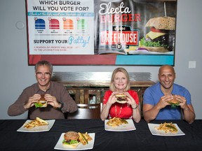 London West candidates Matthew Rowlinson, left, (NDP), Kate Young (Liberal) and Dimitri Lascaris (Green) sit down to hamburgers created in honour of their party leaders at the Byron Freehouse. Conservative candidate Ed Holder declined  invitations to participate. (DEREK RUTTAN, The London Free Press)