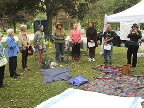 Members of PeaceQuest gather in City Park in Kingston, Ont. on Monday, Sept. 21, 2015 to mark an International Day of Peace with songs, readings and a picnic lunch. Michael Lea/The Whig-Standard/Postmedia Network