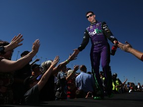 Denny Hamlin gets some love from fans at the NASCAR Sprint Cup Series MyAFibRisk.com 400 at Chicagoland Speedway on Sunday. (AFP)