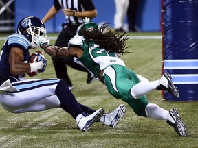 Vidal Hazelton of the Argonauts catches the ball for a touchdown against Alex Suber of the Roughriders during CFL action at the Rogers Centre in Toronto on Aug. 8, 2015. (Dave Abel/Toronto Sun)