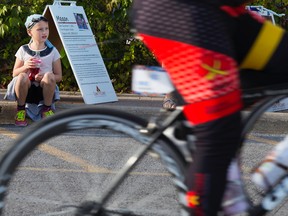 Seven-year-old Alison Vallier watches bikers arrive outside the Sears distribution centre at a stop for the Sears National Kids Cancer Ride on Monday Belleville. Alison was diagnosed with acute lymphoid leukemia (ALL) in January of this year.