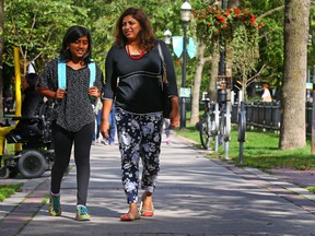 Nisha Naug, 42, and daughter Richa, 11 walk home from Market Lane Public School on Monday. (DAVE ABEL, Toronto Sun)