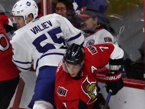 Maple Leafs prospect Rinat Valiev (left) and Senators’ Kyle Turris get tangled up during pre-season action at the Canadian Tire Centre in Ottawa on Monday night. (MIKE CARROCCETTO/POSTMEDIA NETWORK)