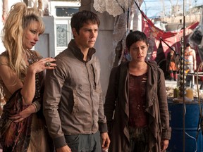 In this image released by 20th Century Fox, Jenny Gabrielle, from left, Dylan O’Brien and Rosa Salazar appear in a scene from the film, "Maze Runner: The Scorch Trials." (Richard Foreman, Jr./20th Century Fox via AP)