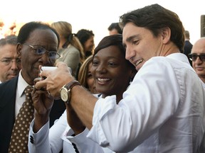 Liberal leader Justin Trudeau takes a selfie with a supporter during a campaign stop in Montreal, on Sept. 22, 2015. (THE CANADIAN PRESS/Adrian Wyld)