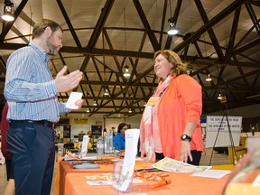 Dr. Adam Gorner (l) speaks with NDP Foothills candidate Alison Thompson (r) on Friday, Sept. 11 at the Pincher Creek trade show. John Stoesser photo/Pincher Creek Echo.