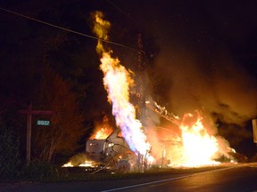 An SUV goes up in flames on Winston Churchill Boulevard, near #10 Sideroad, in Halton Hills, on Monday, Sept. 21, 2015 after an alleged drunk driver hit a gas line. (Andrew Collins photo)