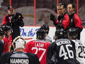 Ottawa Senators head coach Dave Cameron instructs his players during team practice at the Canadian Tire Centre in Ottawa on Tuesday September 22, 2015. Errol McGihon/Ottawa Sun/Postmedia Network