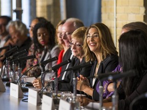 Author Naomi Klein (3rd R) speaks during a news conference to launch the "Leap Manifesto: A Call for a Canada Based on Caring for the Earth and One Another " in Toronto, September 15, 2015. The Leap Manifesto is a group consisting of activists, artists, and celebrities that call for strong environmental policy changes and initiatives.  REUTERS/Mark Blinch