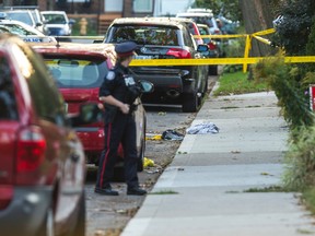 Clothes can be seen at the scene of a stabbing on Keystone Ave., near Woodbine and Danforth Aves., Tuesday September 22, 2015. (Ernest Doroszuk/Toronto Sun)