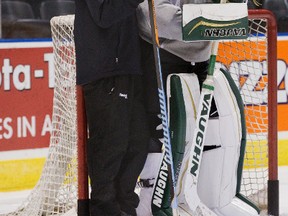 London Knights goalie coach Daren Machesny speaks with Emanuel Vella during practice at Budweiser Gardens on Tuesday. Vella, 17, says he?s happy with the Knights and is determined to show his teammates that he can play at the OHL level. (DEREK RUTTAN, The London Free Press)