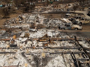 This Sept. 21, 2015, file photo shows shows remains of homes and vehicles scorched by a wildfire in Middletown, Calif. President Barack Obama declared a major disaster Tuesday, Sept. 22, in a deadly Northern California wildfire that has destroyed thousands of homes. (AP Photo/Noah Berger, File)