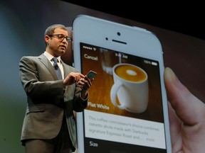 In this March 18, 2015 file photo, Adam Brotman, Starbucks chief digital officer, talks about the company's new mobile ordering app at Starbucks Coffee Company's annual shareholders meeting in Seattle. The Seattle-based coffee chain says its mobile app that lets people order and pay in advance will be available nationally starting Tuesday, Sept. 22, 2015. (AP Photo/Ted S. Warren, File)