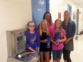 A.A. Wright students and staff pose with their new water fill-up station, from left, Tina Banman, Talia Vancoillie, Shay-Lynn Durward, Christine Peletier and Jen Parrish. Wallaceburg Advisory Team for a Cleaner Habitat (WATCH) donated $1,500 towards the purchase of the station, which is being hailed as a success due to the impact it's having environmentally, as well as providing the students with an alternative to sugary drinks.