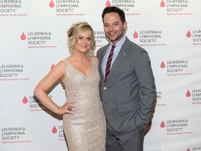 Amy Poehler and Nick Kroll (AFP photo)