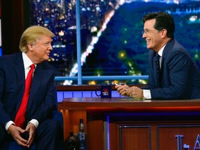 In this photo provided by CBS, Republican presidential candidate Donald Trump, left, joins host Stephen Colbert on the set of “The Late Show with Stephen Colbert,” Tuesday, Sept. 22, 2015, in New York. (John Paul Filo/CBS via AP)