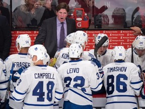 Toronto Maple Leafs' head coach Mike Babcock gives instructions to his players from the bench as they face the Montreal Canadiens during first period NHL pre-season hockey action Tuesday, September 22, 2015, in Montreal. THE CANADIAN PRESS/Paul Chiasson