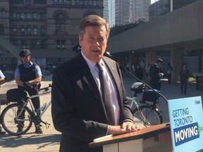 Mayor John Tory is pictured at Nathan Phillips Square on Wednesday. (DON PEAT, Toronto Sun)