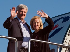 Conservative leader Stephen Harper and his wife, Laureen, wave as they step off the campaign plane in Montreal, on Sept. 22, 2015. (THE CANADIAN PRESS/Ryan Remiorz)
