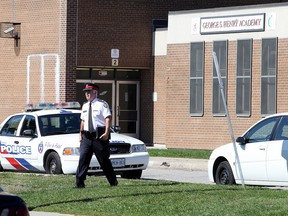Toronto Police investigate a stabbing at George S. Henry Academy during the lunch hour on Sept. 23, 2015. (John Hanley/Special to the Toronto Sun)