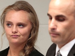 In this Aug. 24, 2015 file photo, Michelle Carter listens to defence attorney Joseph P. Cataldo argue for an involuntary manslaughter charge against her to be dismissed at Juvenile Court in New Bedford, Mass. (Peter Pereira/The New Bedford Standard Times via AP, Pool, File)